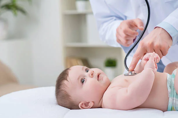 Doctor examining a baby in a caring medical environment